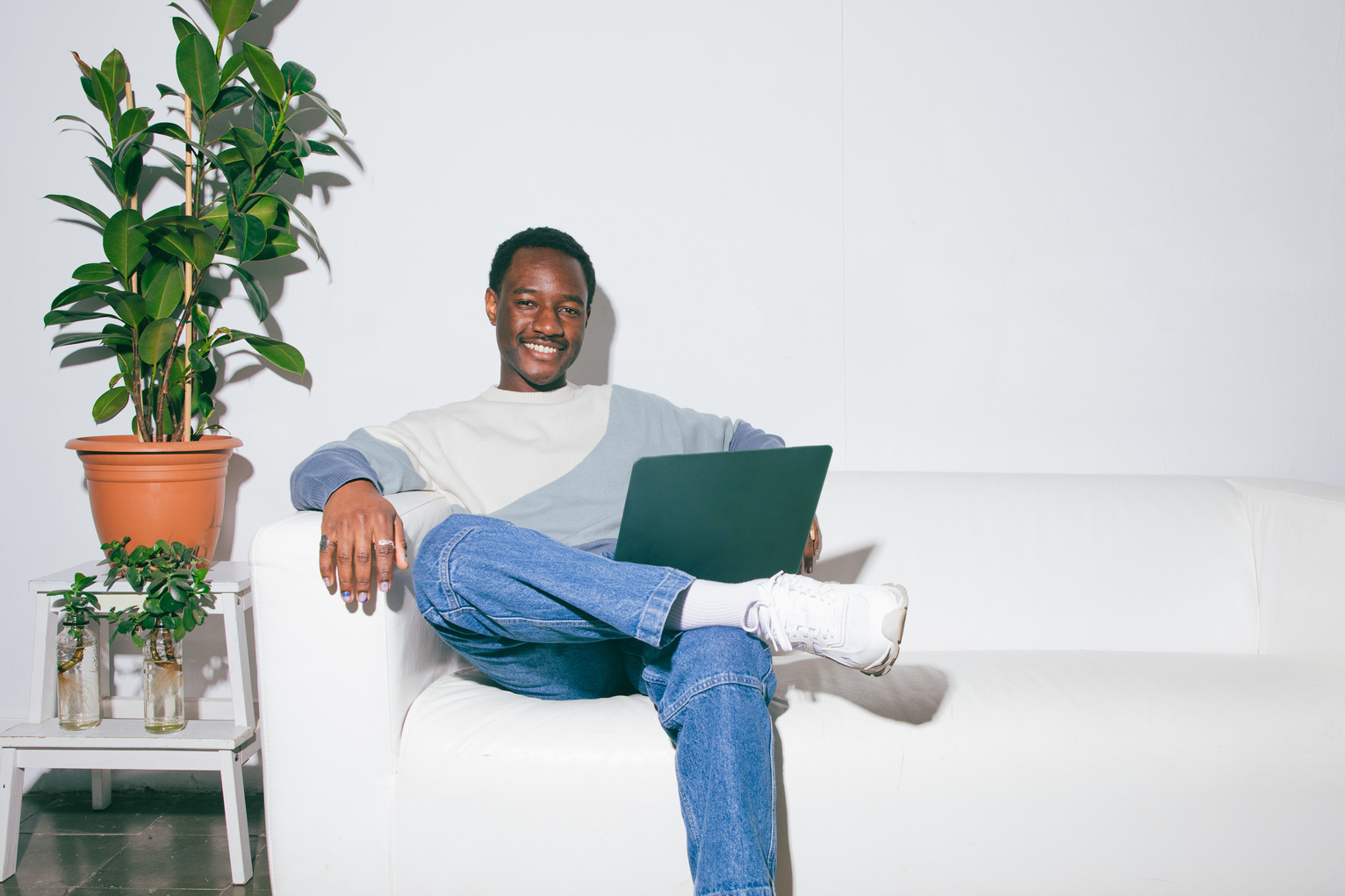 Flash People Portraits Man with Laptop Sitting on a Couch